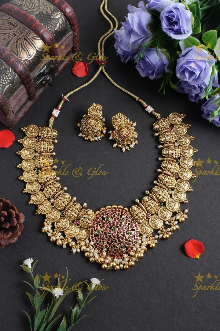 Intricately carved lakshmi carved lakshmi coin peacock pendent gold beads necklace - Sparkle and Glow