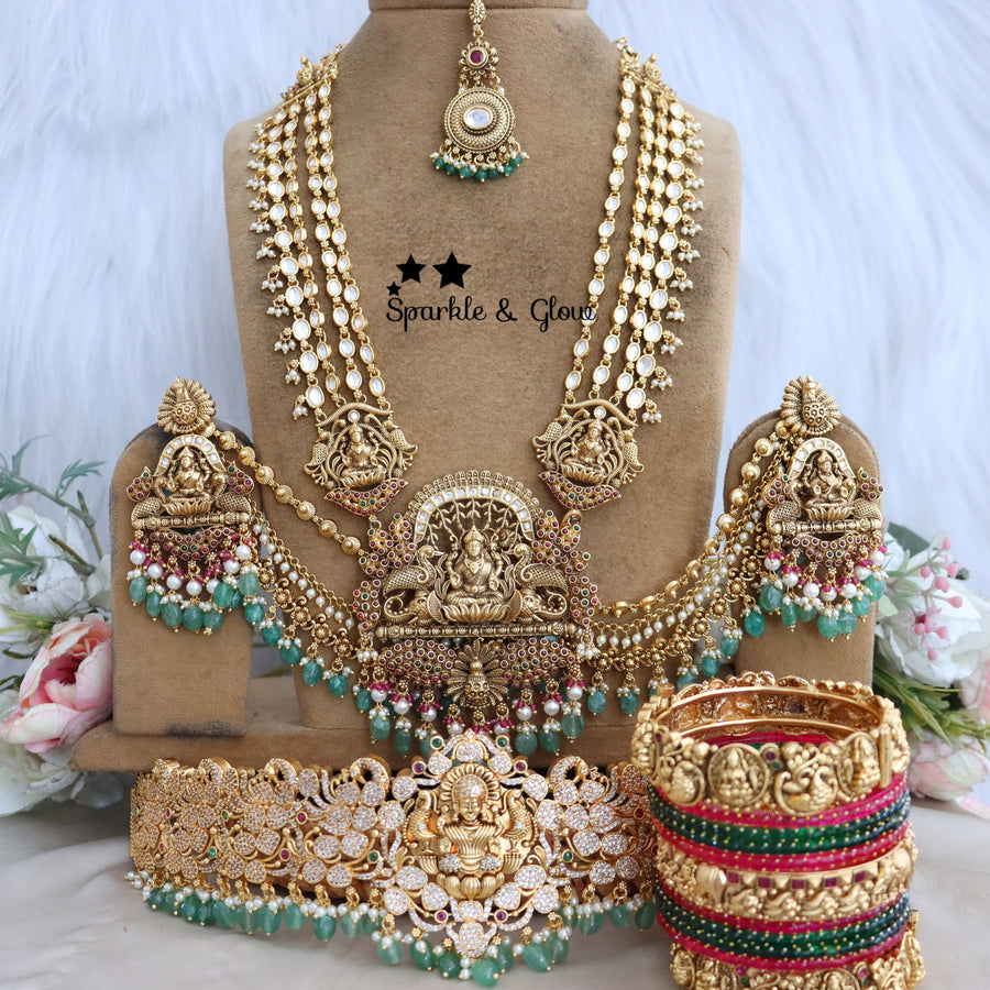 Enhance your bridal look with this beautifully crafted Temple Semi Bridal Set, inspired by traditional South Indian artistry!!
Wedding Season Sale Get 15% discount on sitewide
Get Free Gift Above 10k
Get Free Shipping above 7.5k &30k(Domestic&
International)
Get 7% discount on First Order

1.ID L-6641,H-25253,EC-23478,B-24580,24718,25821_2_4,MT-24491
2.ID L-9206,H-18186,EC-28332,B-24580,24587,25821_2_4,MT-25121
3.ID L-19955,H-18186,EC-23471,B-2945,17419,MT-29027
4.ID L-18097,H-18186,E-17099,EC-27951,B-2945,