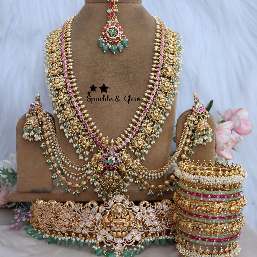 Enhance your bridal look with this beautifully crafted Temple Semi Bridal Set, inspired by traditional South Indian artistry!!
Wedding Season Sale Get 15% discount on sitewide
Get Free Gift Above 10k
Get Free Shipping above 7.5k &30k(Domestic&
International)
Get 7% discount on First Order

1.ID L-6641,H-25253,EC-23478,B-24580,24718,25821_2_4,MT-24491
2.ID L-9206,H-18186,EC-28332,B-24580,24587,25821_2_4,MT-25121
3.ID L-19955,H-18186,EC-23471,B-2945,17419,MT-29027
4.ID L-18097,H-18186,E-17099,EC-27951,B-2945,