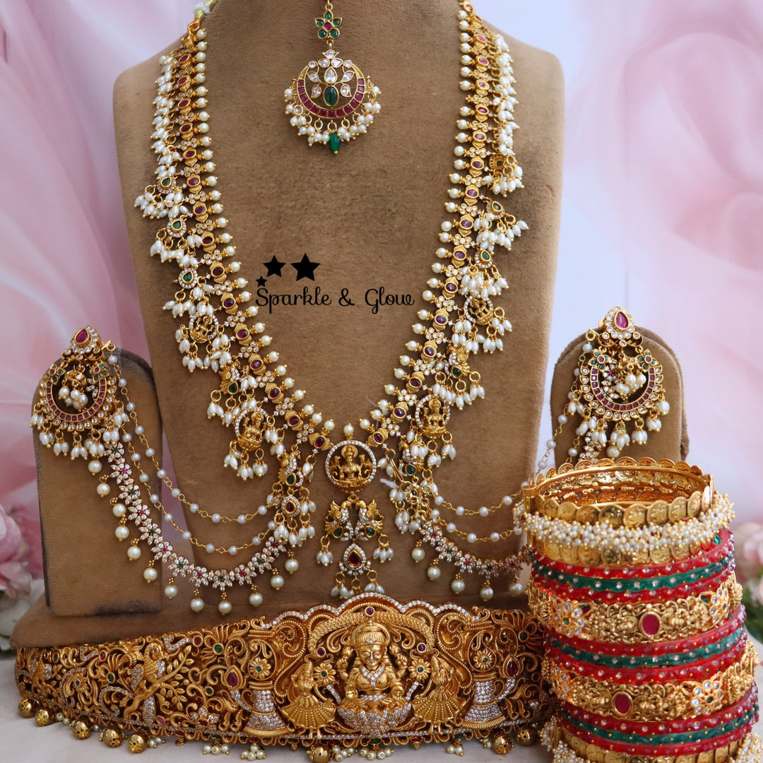 Enhance your bridal look with this beautifully crafted Temple Semi Bridal Set, inspired by traditional South Indian artistry!!
Wedding Season Sale Get 15% discount on sitewide
Get Free Gift Above 10k
Get Free Shipping above 7.5k &30k(Domestic&
International)
Get 7% discount on First Order

1.ID L-6641,H-25253,EC-23478,B-24580,24718,25821_2_4,MT-24491
2.ID L-9206,H-18186,EC-28332,B-24580,24587,25821_2_4,MT-25121
3.ID L-19955,H-18186,EC-23471,B-2945,17419,MT-29027
4.ID L-18097,H-18186,E-17099,EC-27951,B-2945,