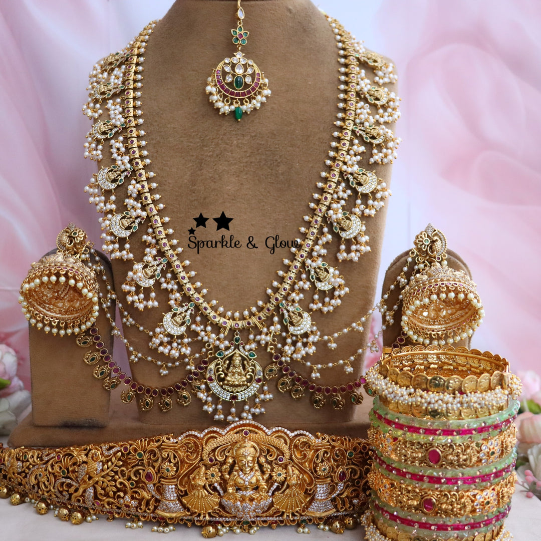 Enhance your bridal look with this beautifully crafted Temple Semi Bridal Set, inspired by traditional South Indian artistry!!
Wedding Season Sale Get 15% discount on sitewide
Get Free Gift Above 10k
Get Free Shipping above 7.5k &30k(Domestic&
International)
Get 7% discount on First Order

1.ID L-6641,H-25253,EC-23478,B-24580,24718,25821_2_4,MT-24491
2.ID L-9206,H-18186,EC-28332,B-24580,24587,25821_2_4,MT-25121
3.ID L-19955,H-18186,EC-23471,B-2945,17419,MT-29027
4.ID L-18097,H-18186,E-17099,EC-27951,B-2945,