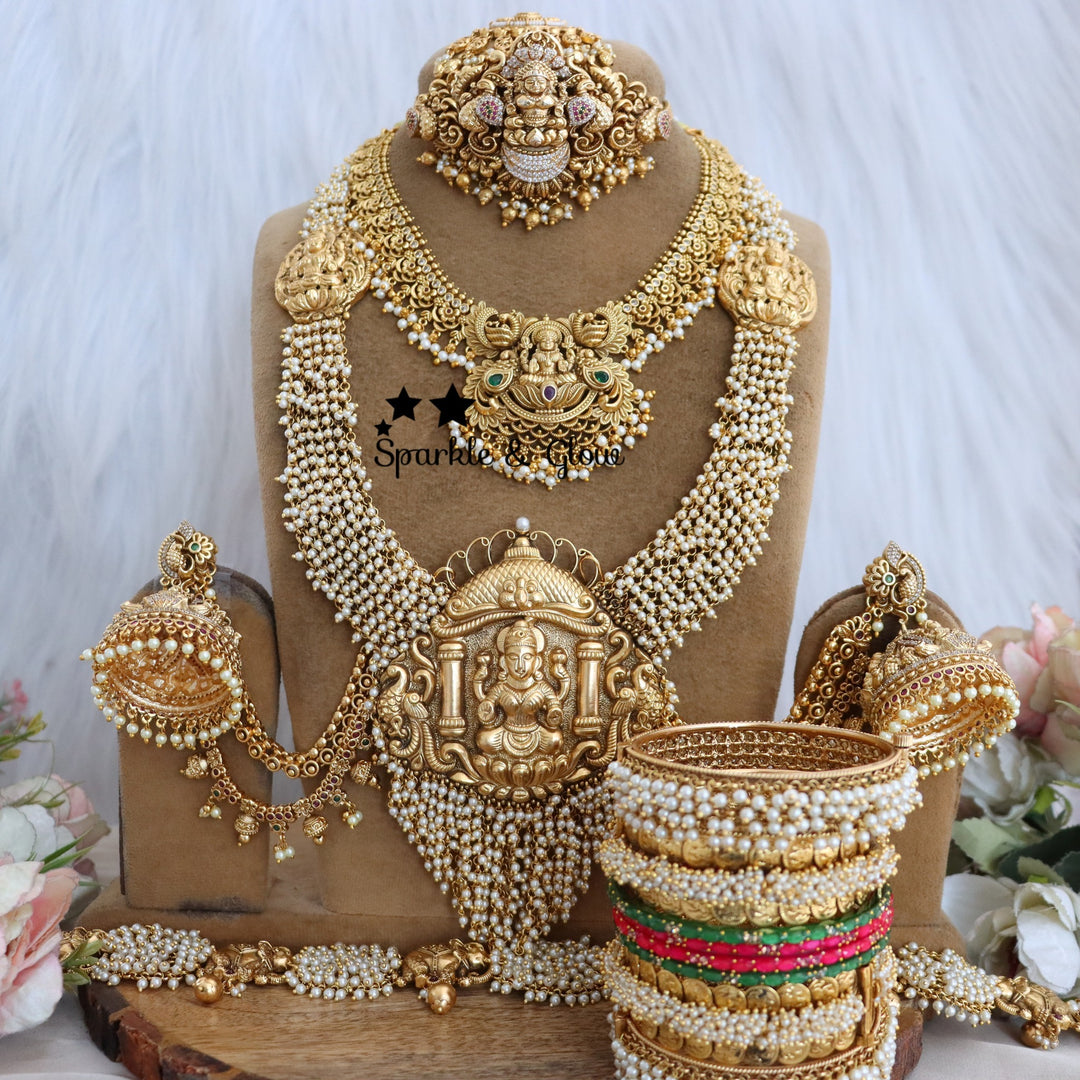 ✨ Grand Temple Bridal Set – Timeless Heritage for the Modern Bride ✨
Adorn yourself with the elegance of tradition with this exquisite Temple Bridal Set!!
Wedding Season Sale Get 15% discount on sitewide
Get Free Gift Above 10k
Get Free Shipping above 7.5k &30k(Domestic&
International)
Get 7% discount on First Order

1.ID L-27183,S-27182,C-28587,H-29587,E-28103,EC-15454
2.ID L-6736,S-1409,C-23414,H-24622,E-6331,EC-12949
3.ID L-12321,S-8390,C-17253,H-18111,E-12803,EC-12538
4.ID L-9959,S-19995,C-28901,H-26115
