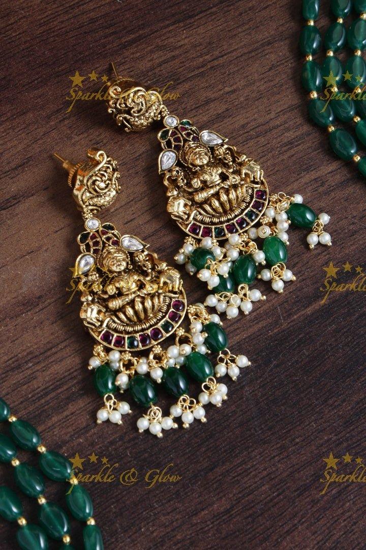Exclusive long green beads necklace with intricately carved lakhsmi pendent - Sparkle and Glow