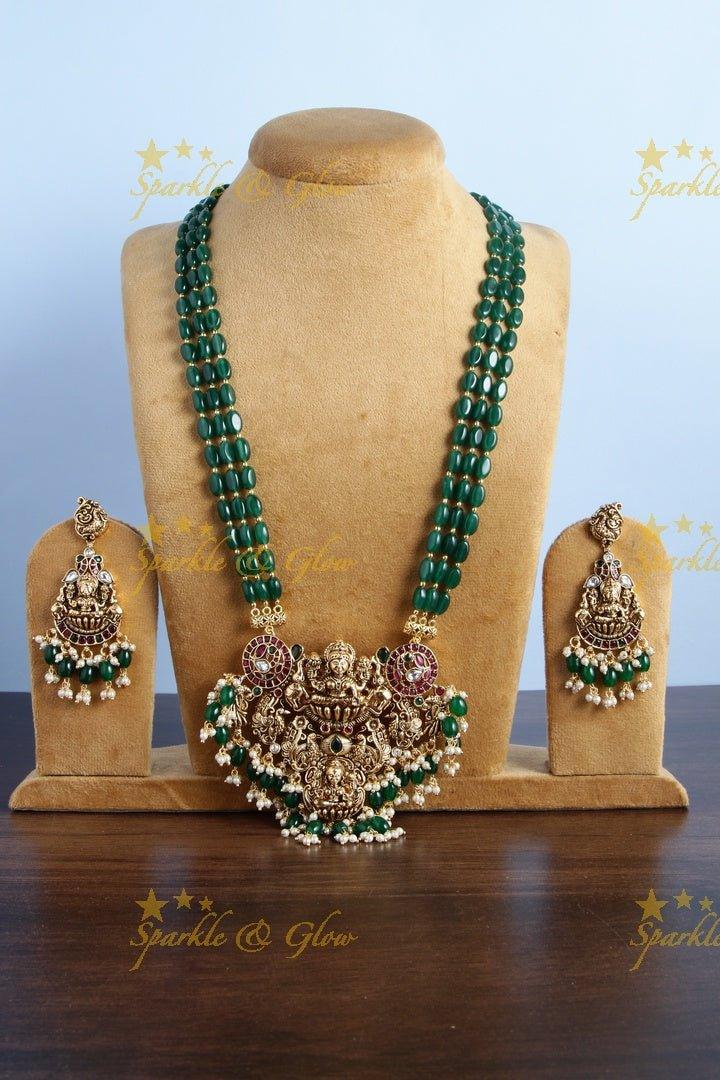Exclusive long green beads necklace with intricately carved lakhsmi pendent - Sparkle and Glow