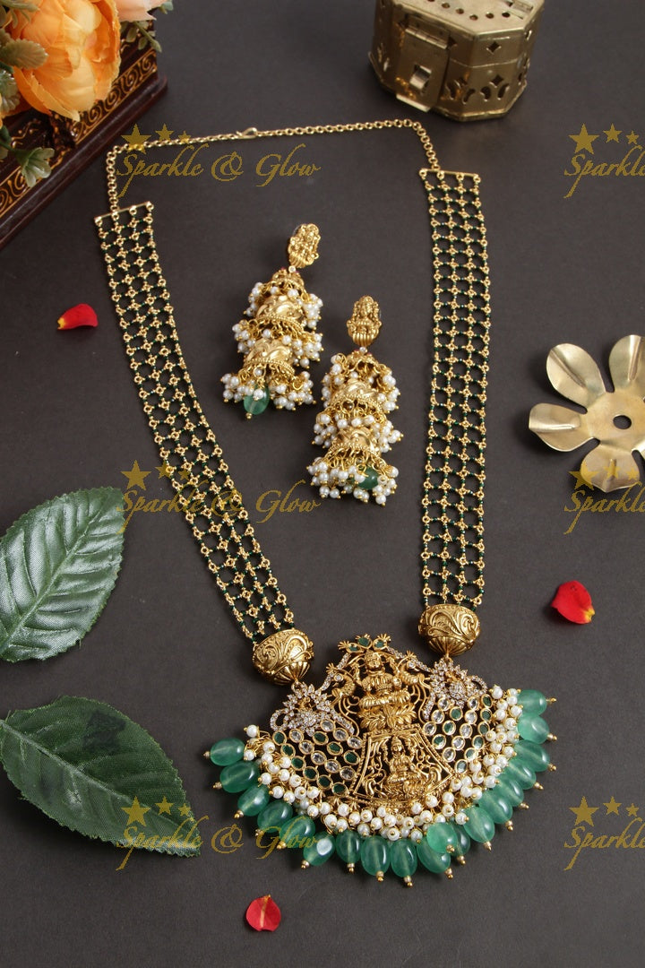 Elegant layered Lakshmi haram with green beads and beautiful step jhumukas