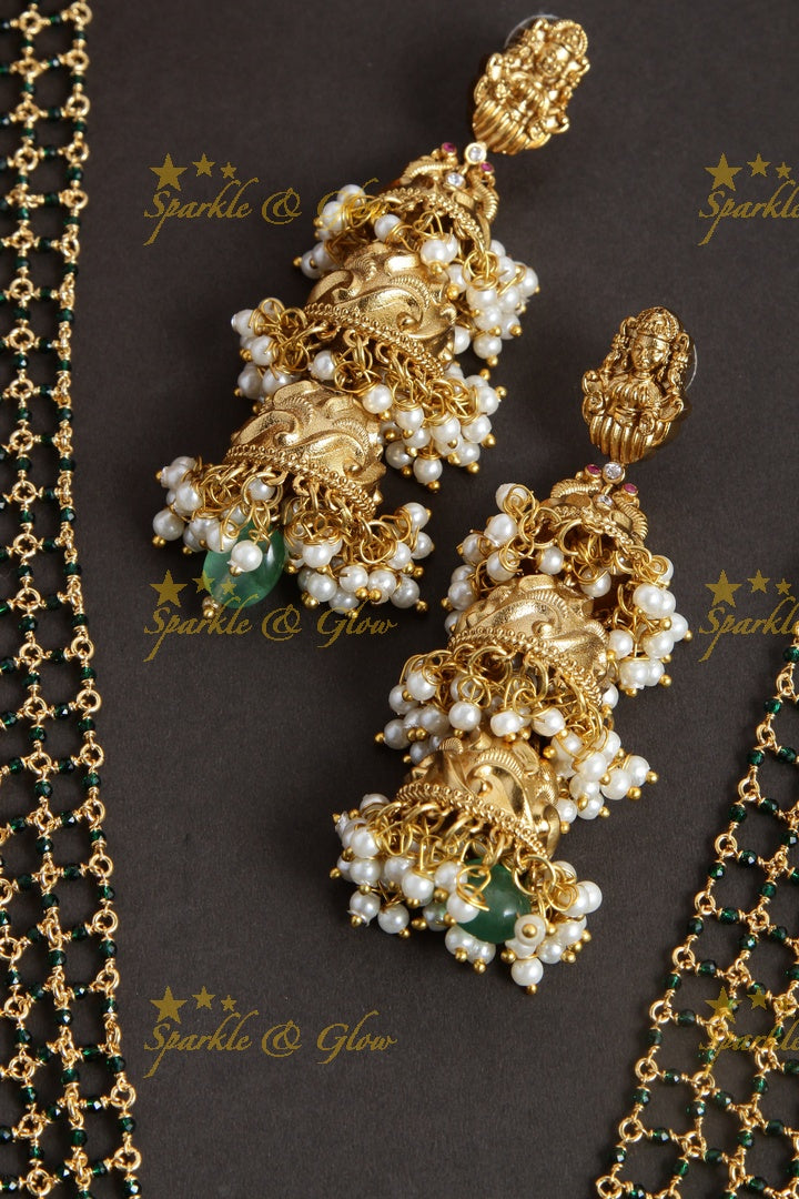 Elegant layered Lakshmi haram with green beads and beautiful step jhumukas