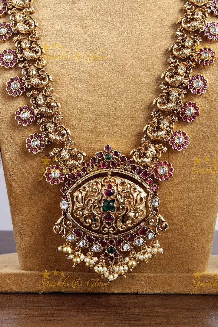 Gold alike floral bottu peacock haram with two sided pendent
