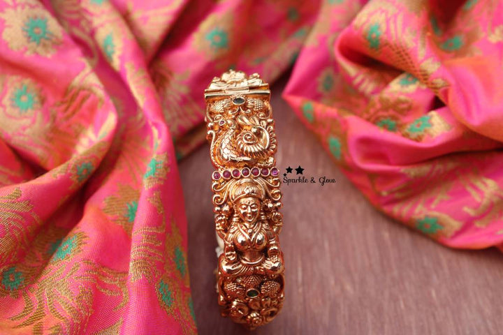 Gold alike polished intricate peacock and lakshmi design bangle 1 pc