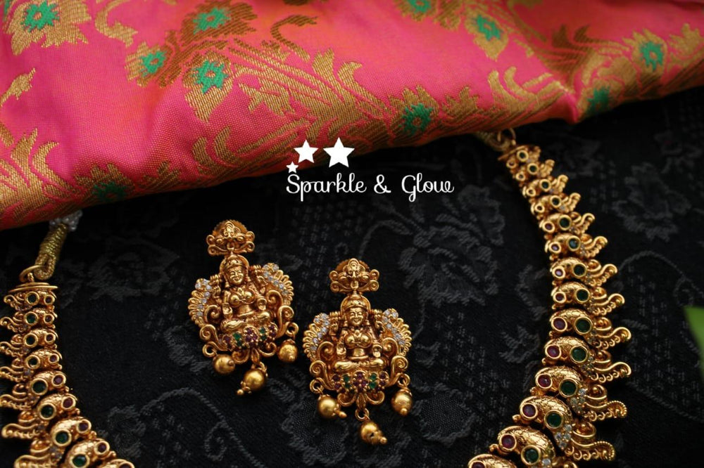 Gold alike polished peacock and lakshmi carved necklace - Sparkle and Glow