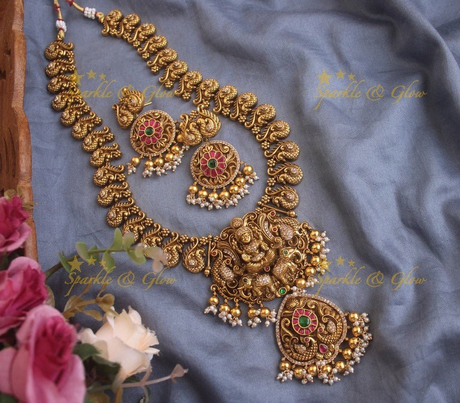 Elegant gold alike Jadau Lakshmi and peacock carved long necklace with green beads - Sparkle and Glow - Gold - Back Thread