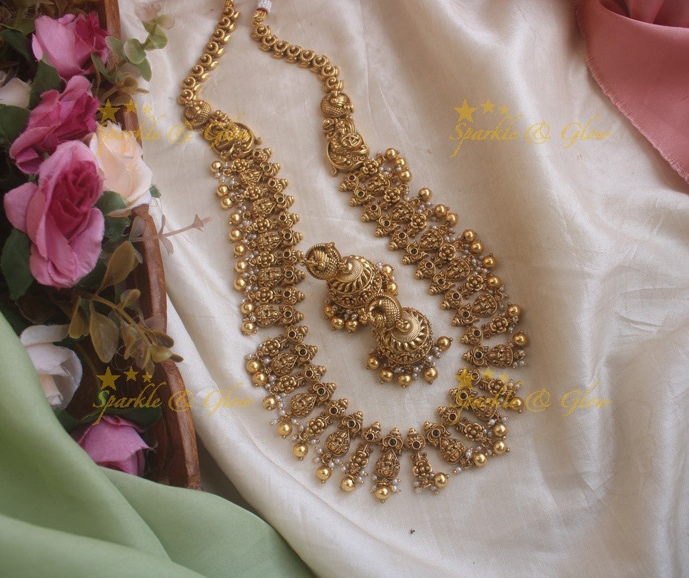 Beautiful gold alike Lakshmi and peacock carved long necklace with gold beads