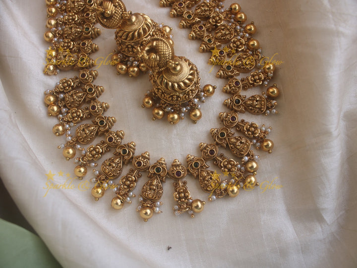 Beautiful gold alike Lakshmi and peacock carved long necklace with gold beads