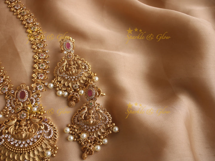 Stunning premium dull matte finish Lakshmi and peacock carved long necklace with stones and pearls
