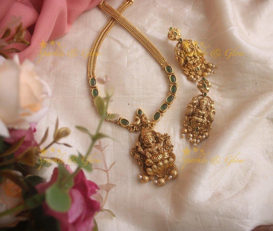 Elegant gold alike Lakshmi and peacock carved short necklace with Ruby stones - Sparkle and Glow