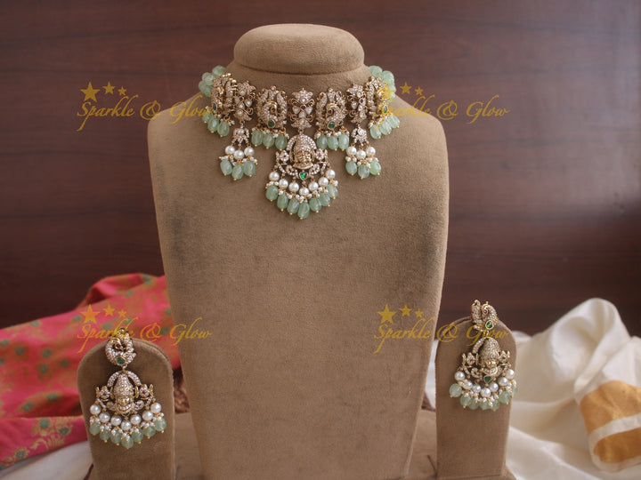 Exquisite Venkatesh peacock Victorian AD highneck choker with pastel green beads