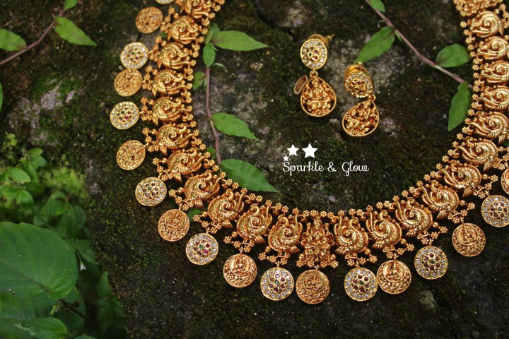 Gold alike polished peacock style lakshmi coin necklace with stones