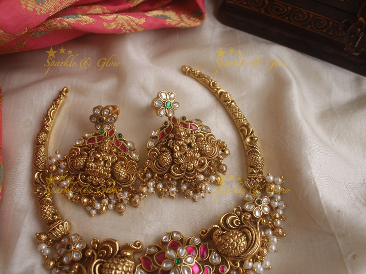 Beautiful Lakshmi peacock and floral design jadau short necklace with pink green and white stones and pearls