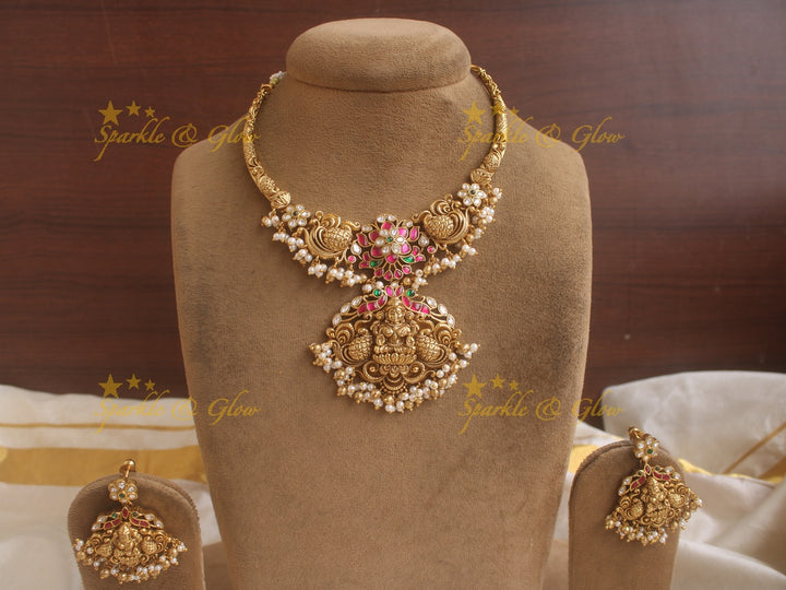 Beautiful Lakshmi peacock and floral design jadau short necklace with pink green and white stones and pearls