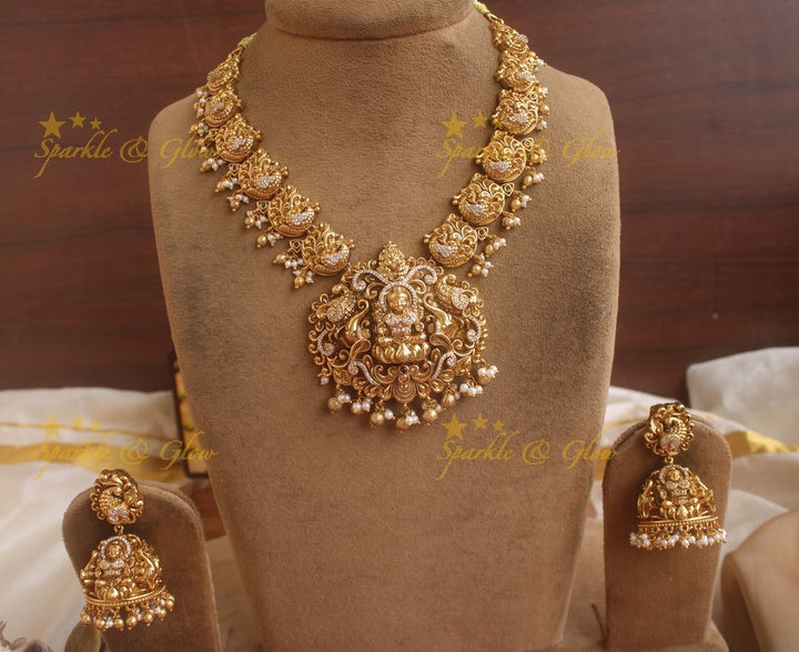Exquisite gold alike Lakshmi and peacock carved short necklace with pearls and gold beads