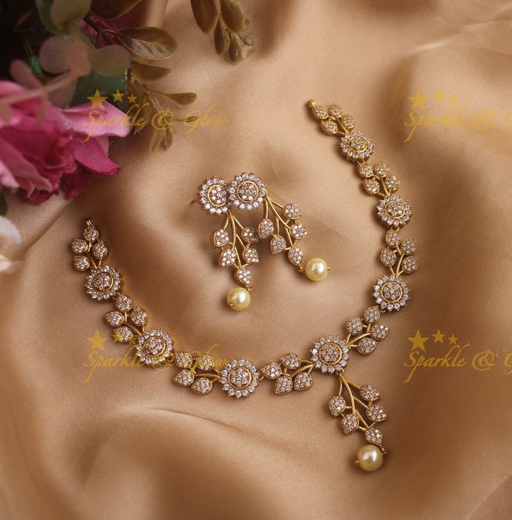 Statement Ad necklace with flower and leaf design with pearls