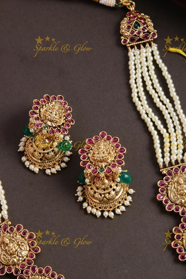 Grand Lakshmi peacock long necklace with multi layer pearl chain red colour stones and green beads - Sparkle and Glow