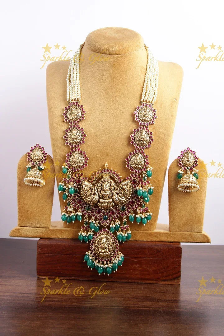 Grand Lakshmi peacock long necklace with multi layer pearl chain red colour stones and green beads - Sparkle and Glow