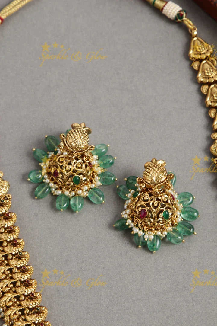 Grand intricate Peacock carved long necklace with ruby and mint green beads - Sparkle and Glow