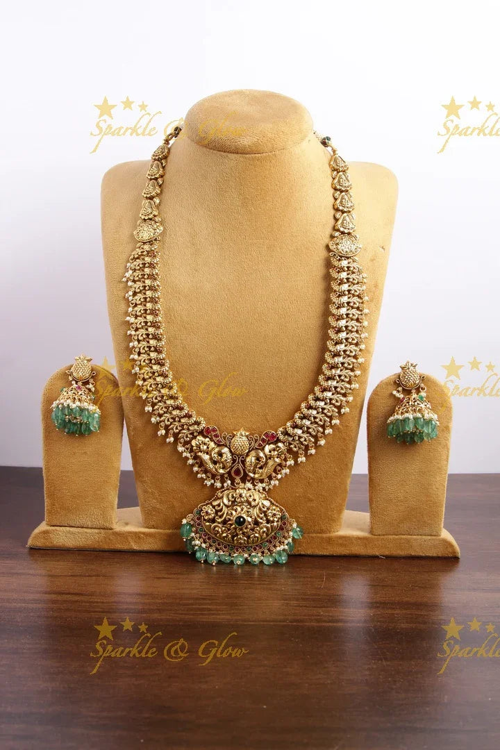 Grand intricate Peacock carved long necklace with ruby and mint green beads - Sparkle and Glow