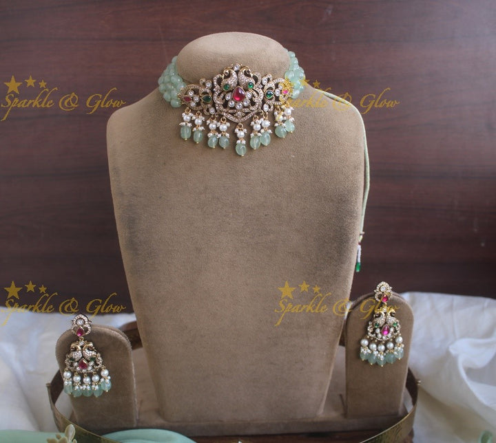 Elegant Peacock Victorian AD choker with pearls and mint green beads