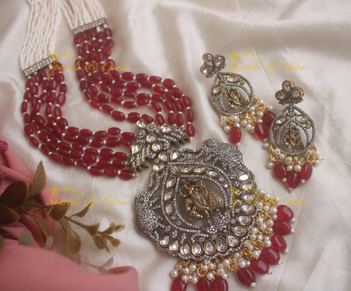Statement Radha krishna pendent Victorian AD haram with multi layer red beads and pearl chain - red