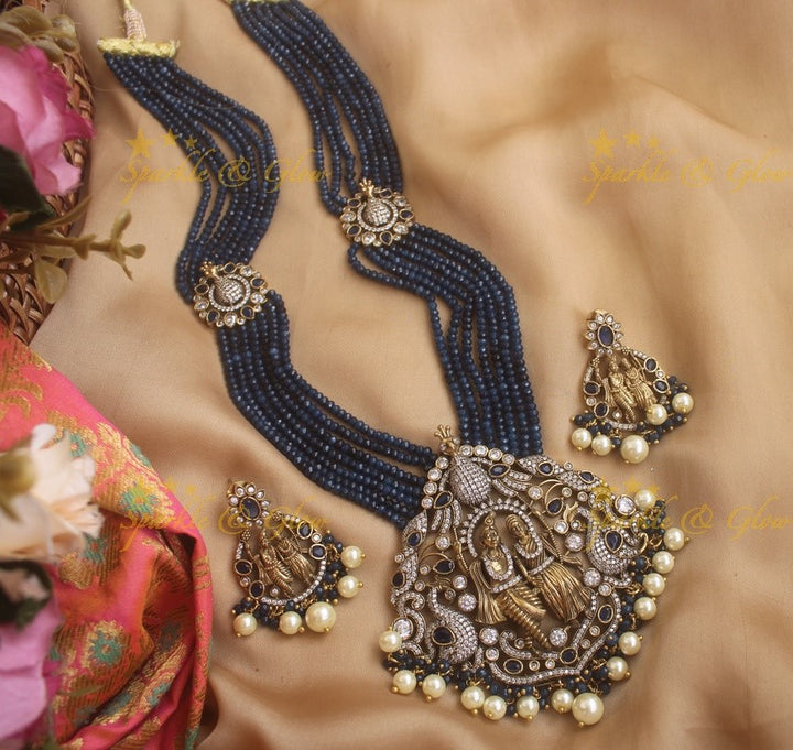 Statement Radha Krishna pendent Victorian AD haram with multi layer red beads chain - red