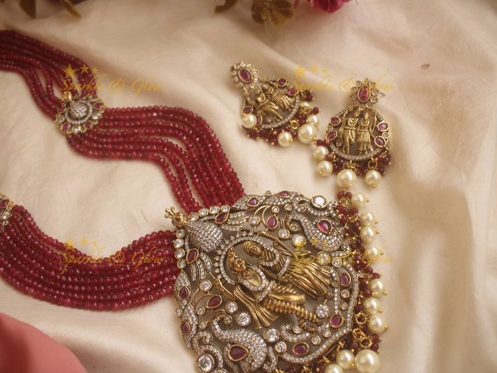 Statement Radha Krishna pendent Victorian AD haram with multi layer red beads chain - red