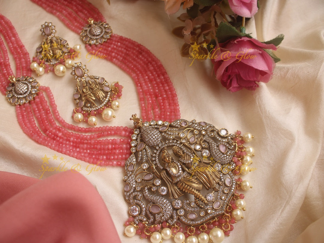 Stunning Radha Krishna pendent Victorian AD haram with multi layer peach beads chain - peach