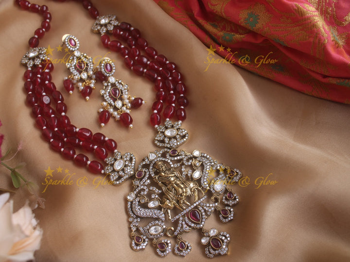 Exquisite Krishna playing flute pendent Victorian AD haram with multi layer red beads chain - red