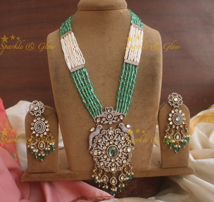 Grand floral pendent Victorian AD haram with multi layer green beads and pearl chain