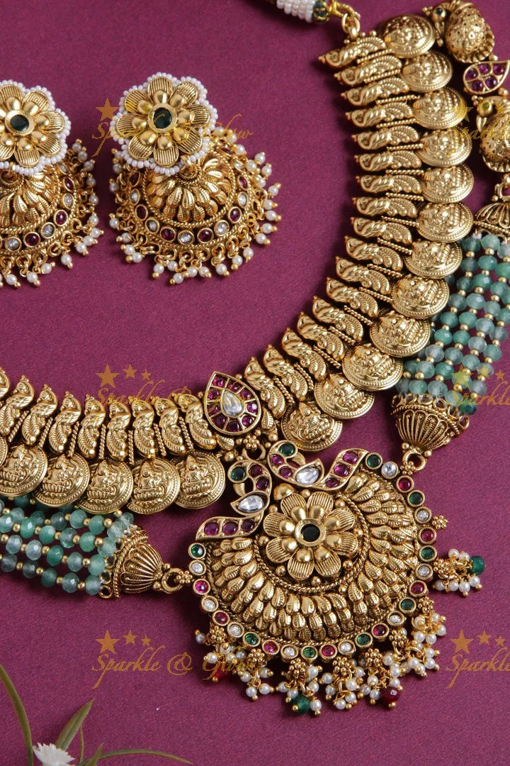 Gold alike Lakshmi coin and peacock short necklace with layered mint green beads - Sparkle and Glow