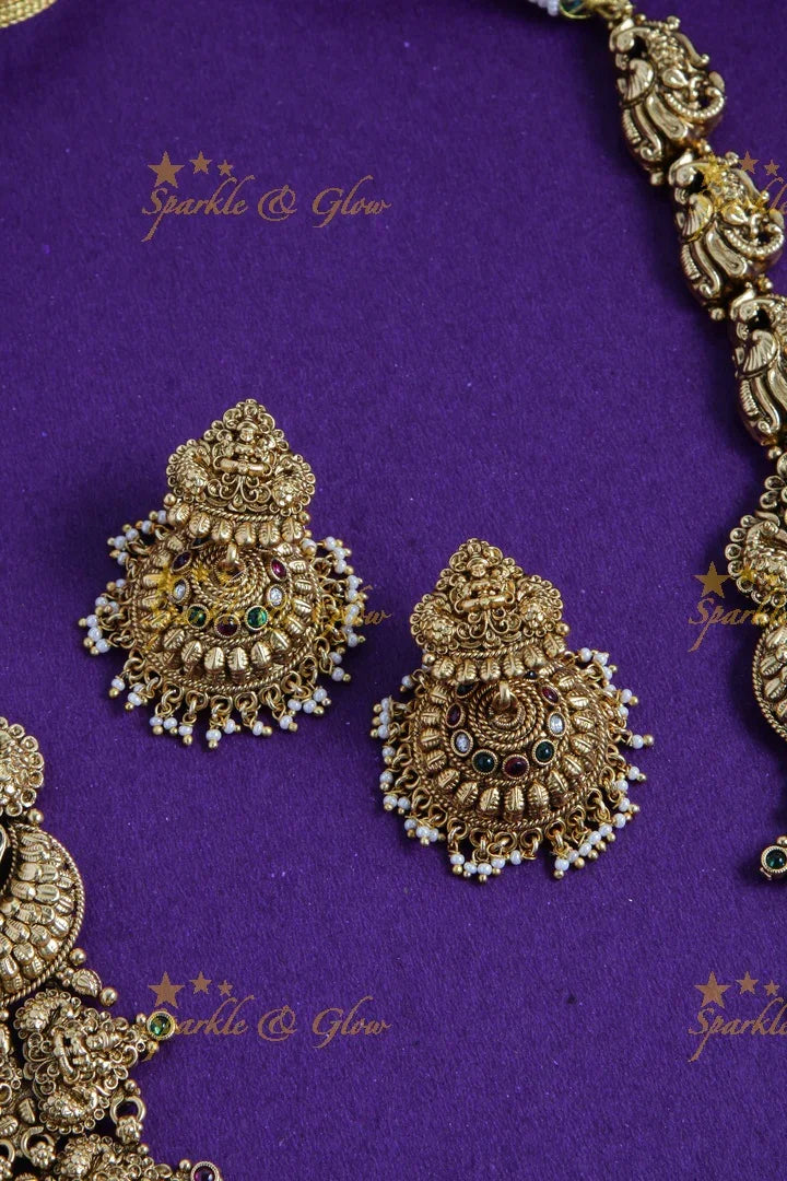 Grand gold alike lakshmi peacock carved long necklace with sea blue beads and pearls - Sparkle and Glow