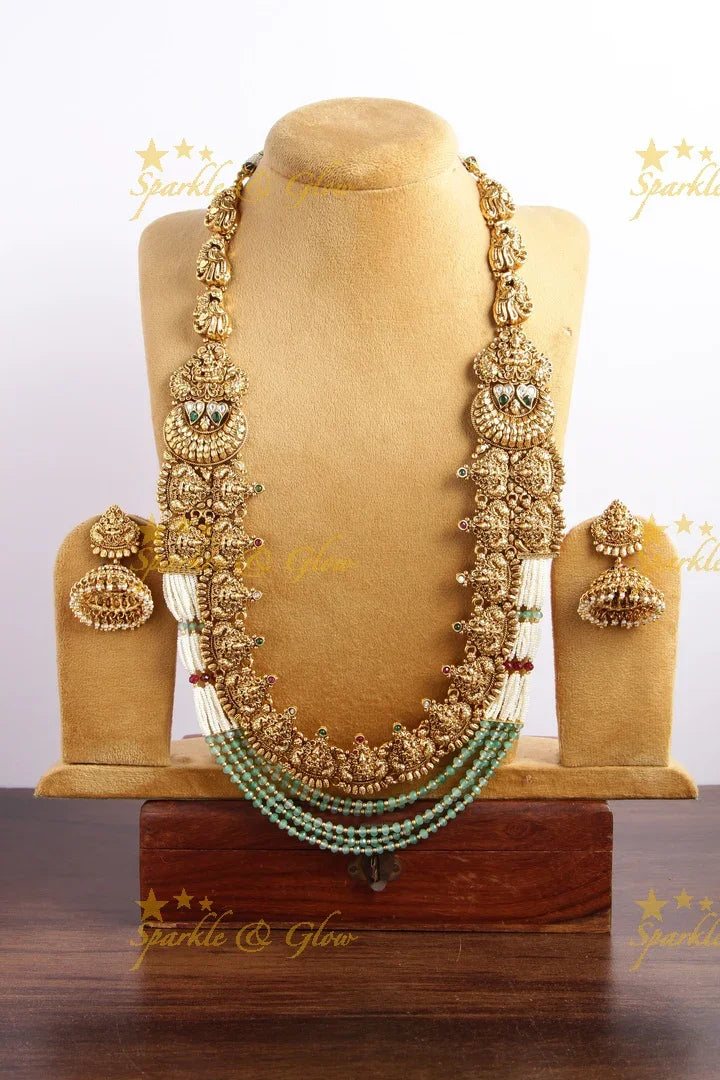 Grand gold alike lakshmi peacock carved long necklace with sea blue beads and pearls - Sparkle and Glow