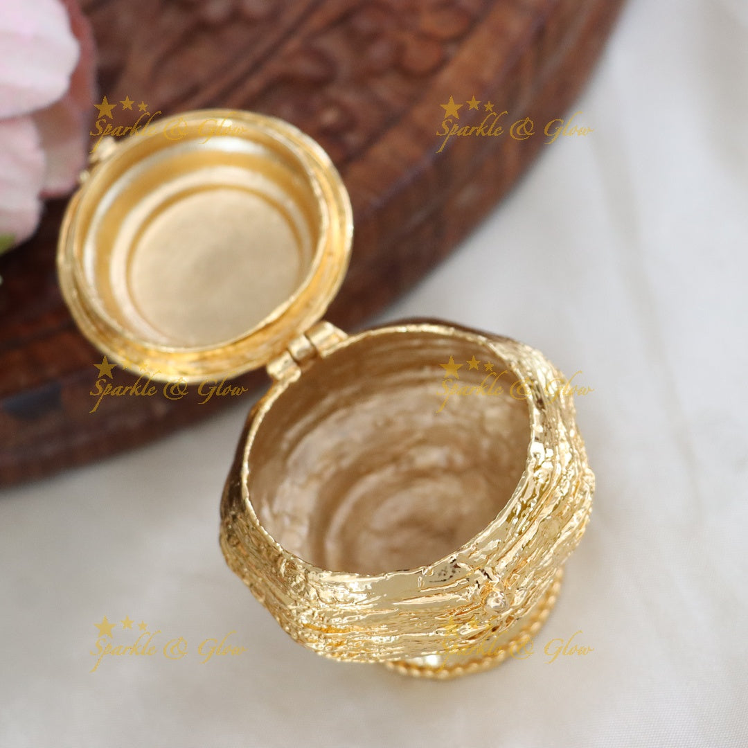 Traditional Gold Kumkum Box with Floral Design