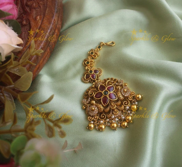 Gold alike floral peacock maang tikka with cz stones ruby emerald and green beads - Sparkle and Glow