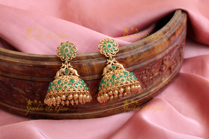 Elegant peacock gold alike jhumukas with green stones