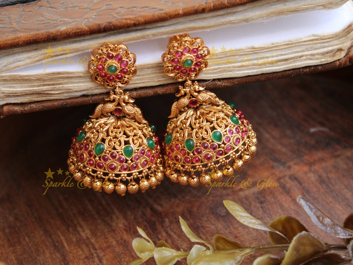 Elegant peacock gold alike jhumukas with green stones