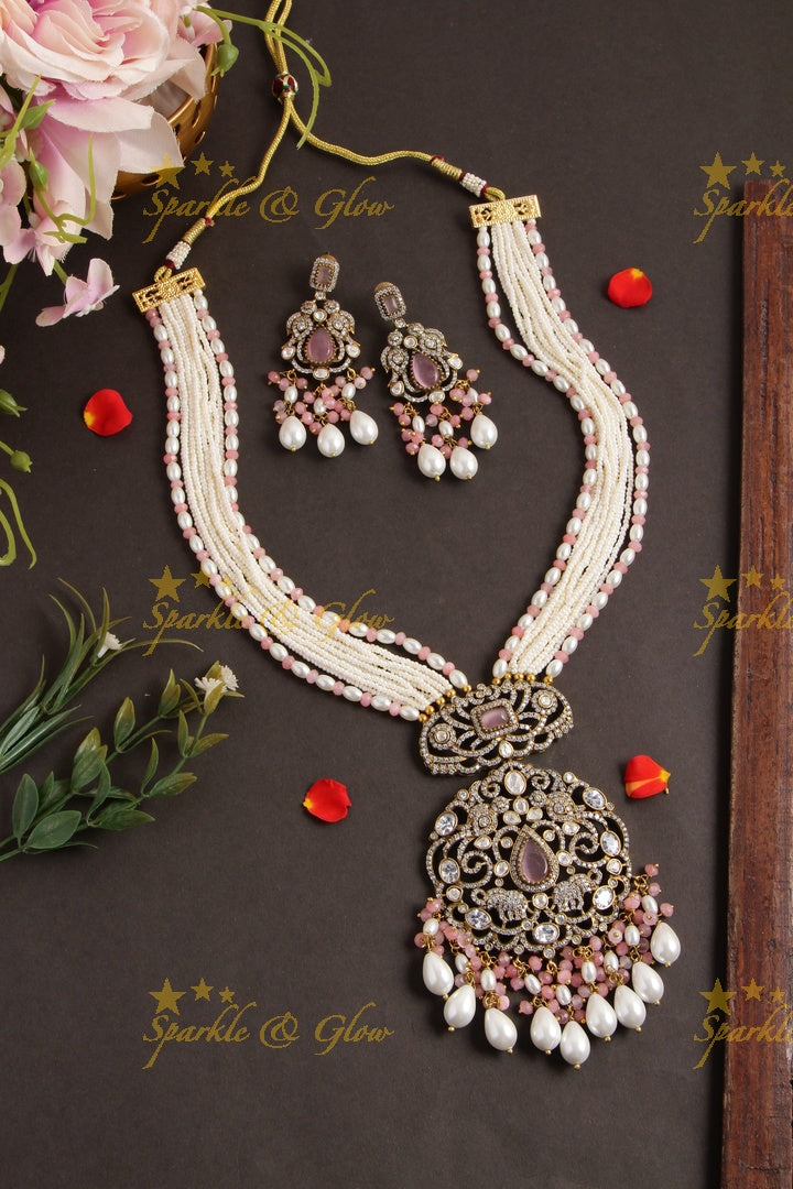 Elegant Peacock elephant pendent Victorian AD haram with multi layer pearl chain and peach white beads