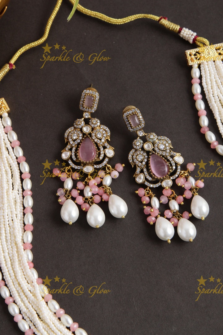 Elegant Peacock elephant pendent Victorian AD haram with multi layer pearl chain and peach white beads