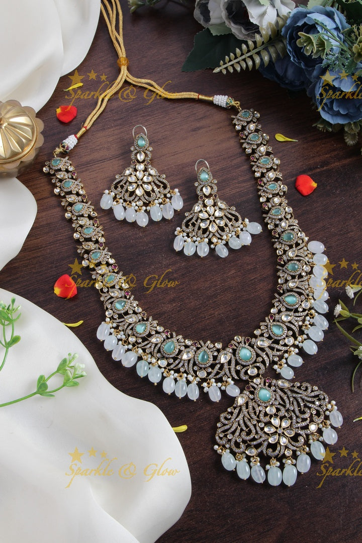 Gorgeous peacock and floral design Victorian AD long necklace with sea blue stones and beads