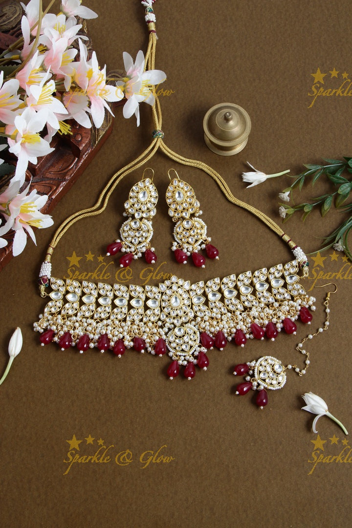 Grand floral design kundan choker with pearls and red beads