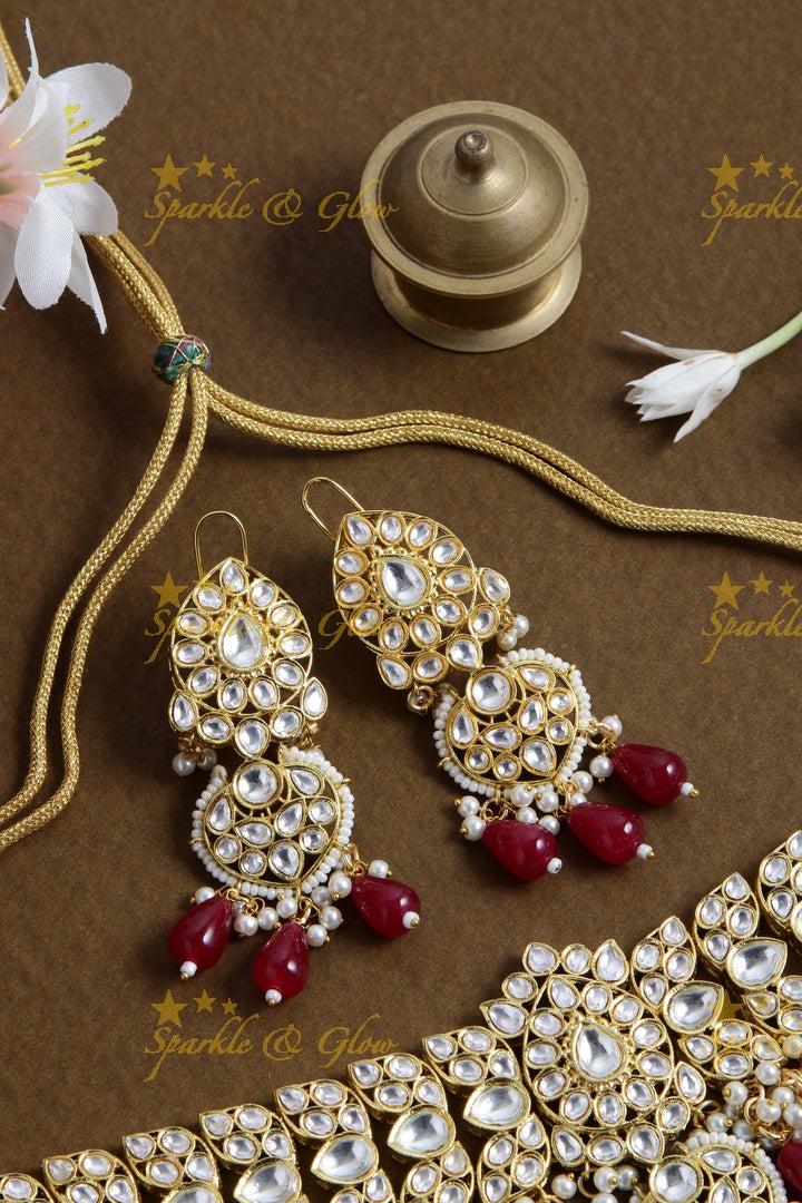 Grand floral design kundan choker with pearls and red beads