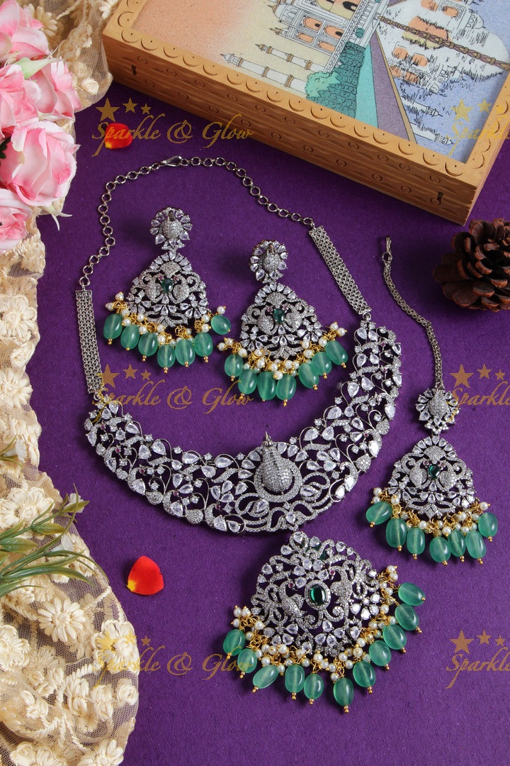 Exquisite peacock carved black finish Victorian AD long necklace with pearls and red beads - with mang tikka