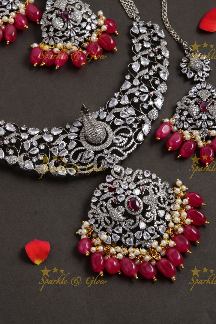 Exquisite peacock carved black finish Victorian AD long necklace with pearls and red beads - with mang tikka