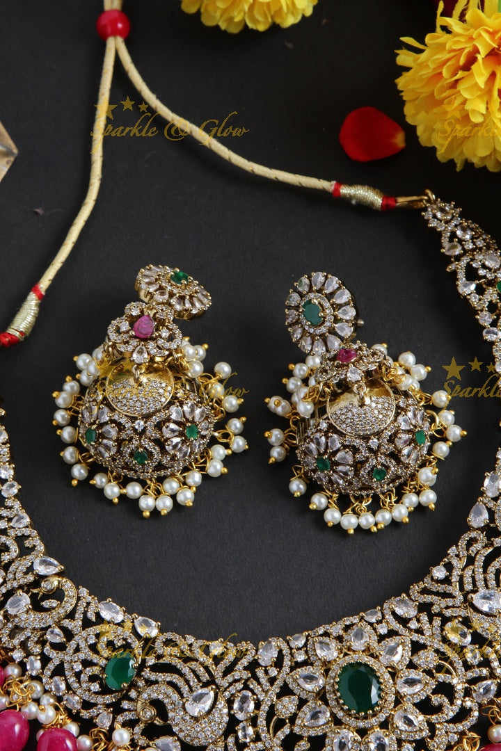 Exclusive peacock and floral design Victorian AD short necklace with multi colour stones and red beads
